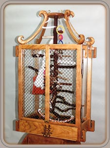 This wooden bird cage is one of many custom bird cages built by Architectural Arts.